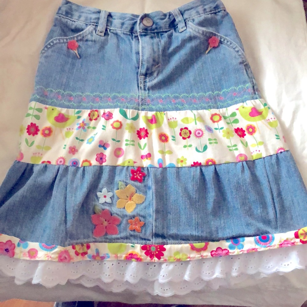 Girl’s custom made denim skirt with custom embroidery.  Length 16”. Waist 20”